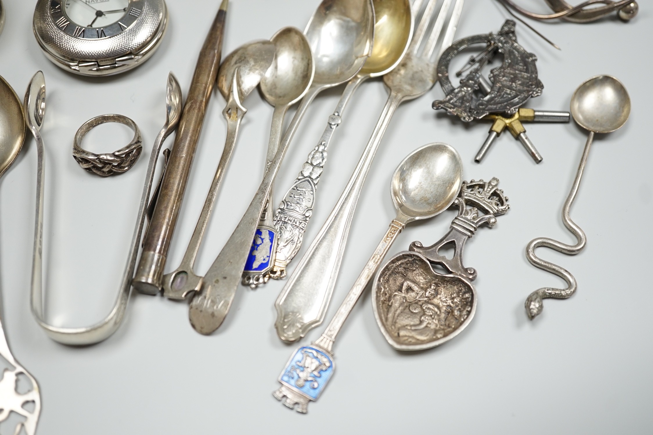 Sundry small silver including two sauceboats, napkin rings, mounted glass condiment bottle, pepperette, pair of silver gilt preserve spoons, minor flatware including white metal, a 1920's Georg Jensen silver cream ladle,